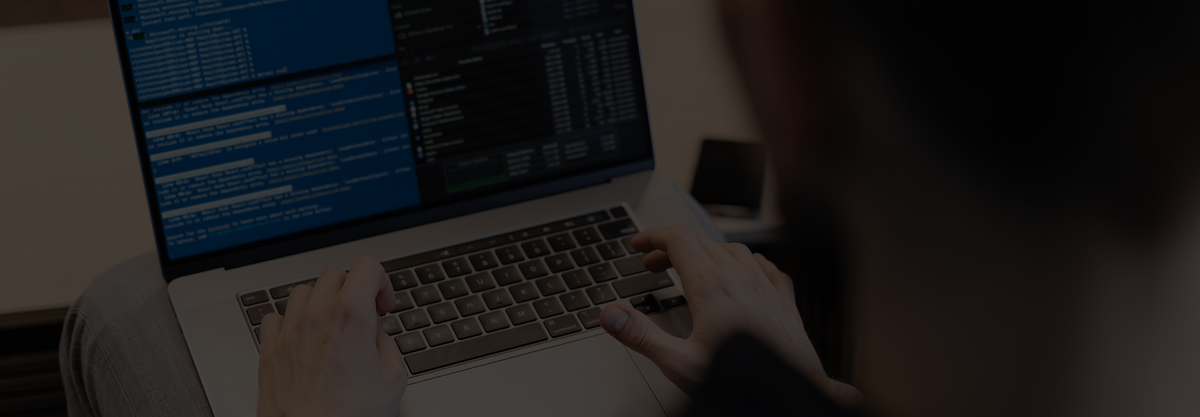 close-up-man-writing-code-laptop